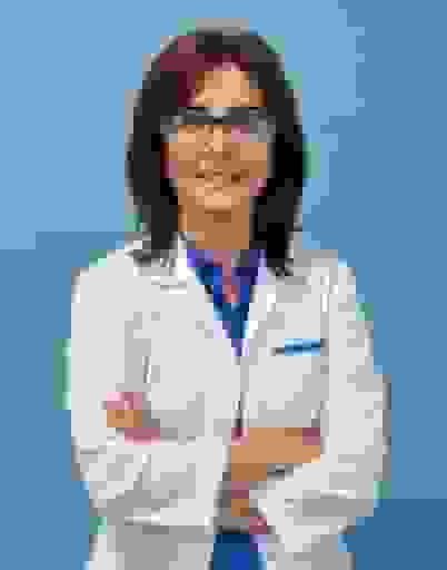 A woman in a white lab coat and glasses against a blue background
