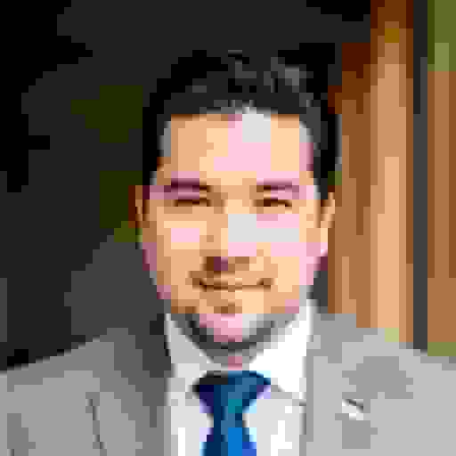 professional headshot of a white guy with blue suit