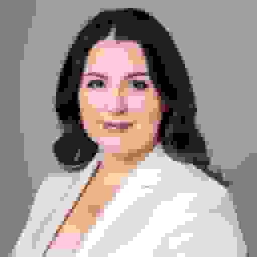 professional portrait of a white woman with white suit