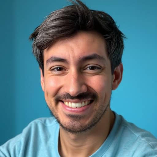 Secta AI result, a closely framed smiling head-and-shoulders portrait of the man in a light blue t-shirt against a plain bright blue background, with dark hair greying through, a moustache and a short beard