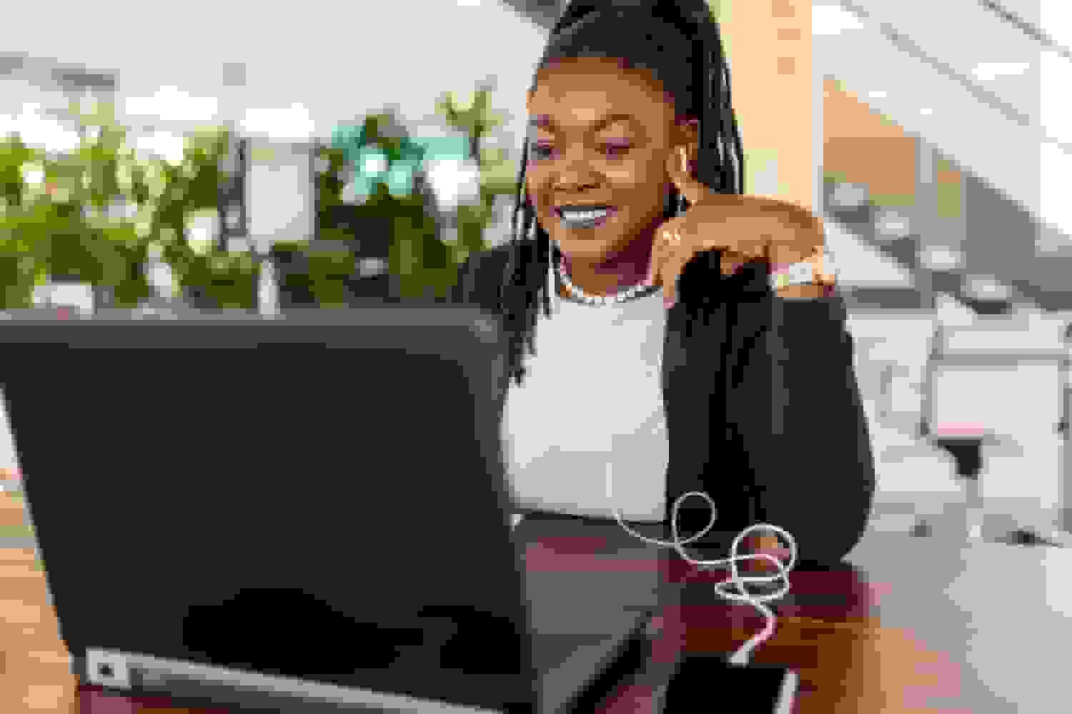 ai LinkedIn Headshot woman working laptop